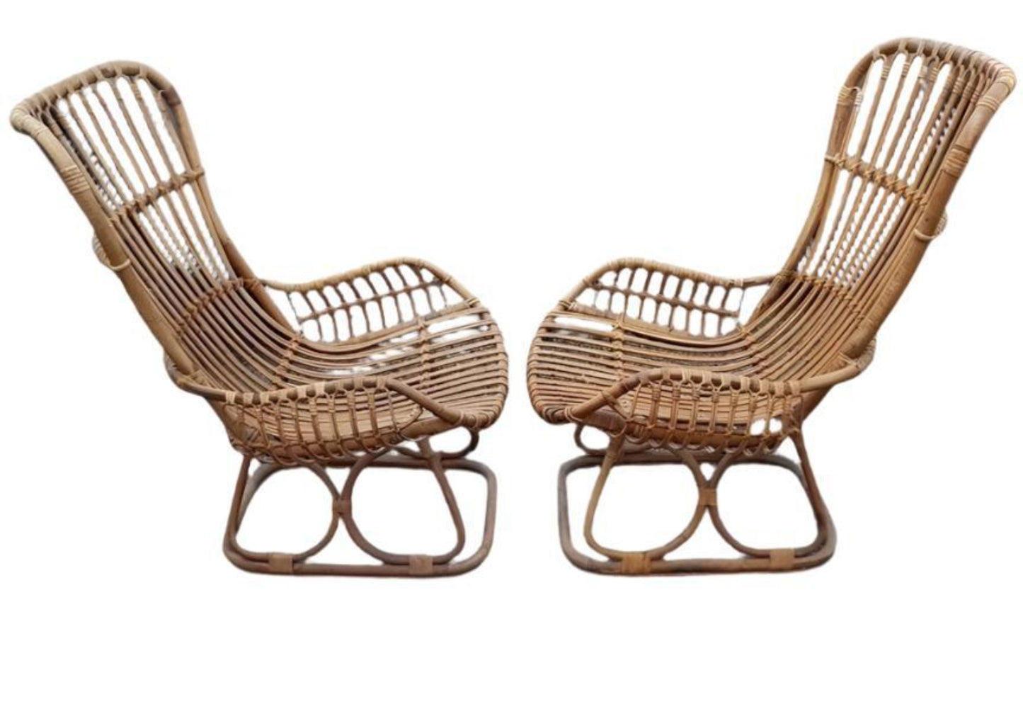 a pair of Tito Agnoli cane chairs