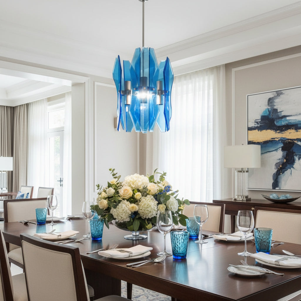 Dining room with a blue glass chandelier, floral centerpiece, and set table.