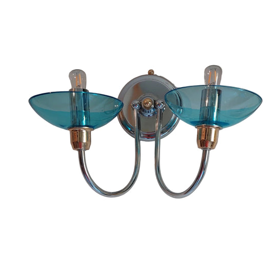 Wall-mounted light fixture with blue glass shades on a white background