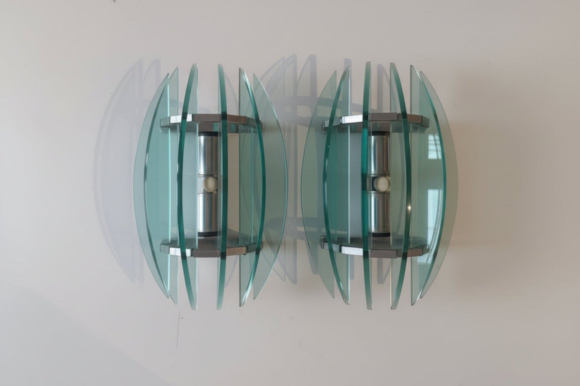 pair of glass wall ights with turquoise glass rom Veca