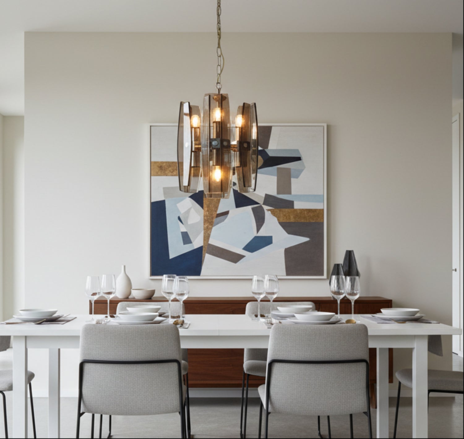 mid century glass lamp over a modern dining room table with an abstract painting