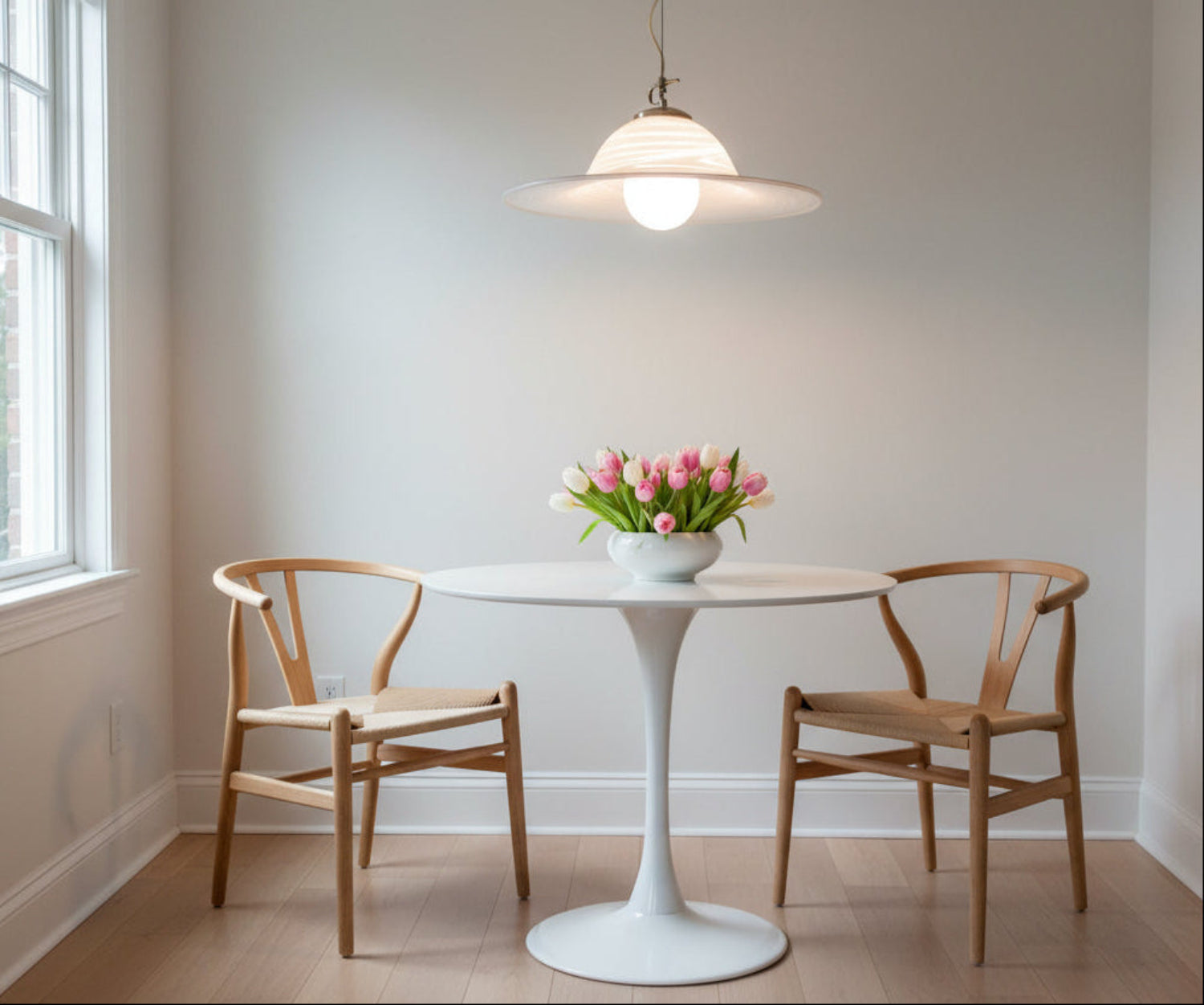Vintage-style pendant light with wavy glass shade in a room setting.